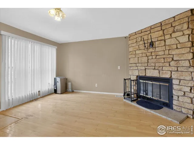 a kitchen with granite countertop a sink and a refrigerator