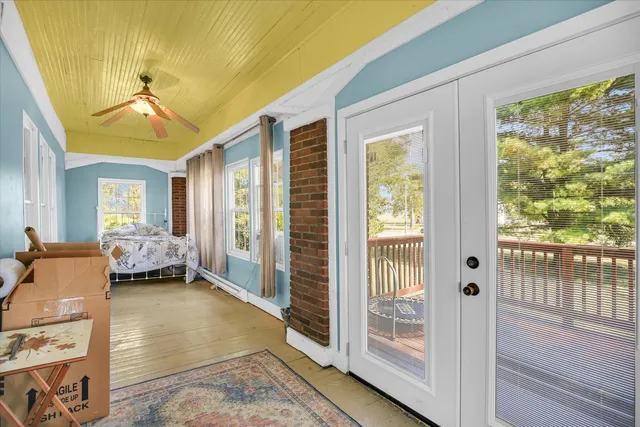 a view of hall way with furniture