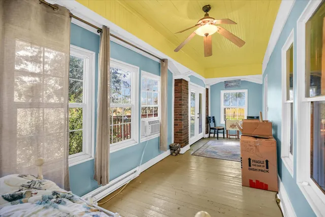 a view of a livingroom with furniture and windows