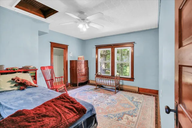 a bed room with a bed and a chandelier