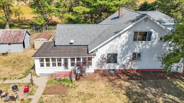 a aerial view of a house with a yard