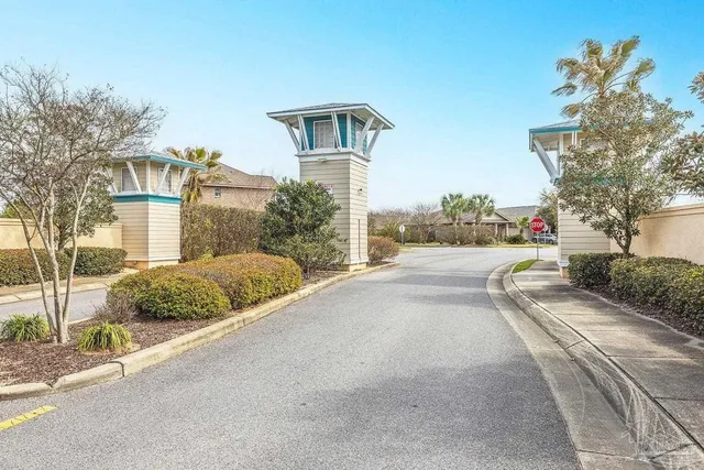 a view of a street with a cars parked on the road