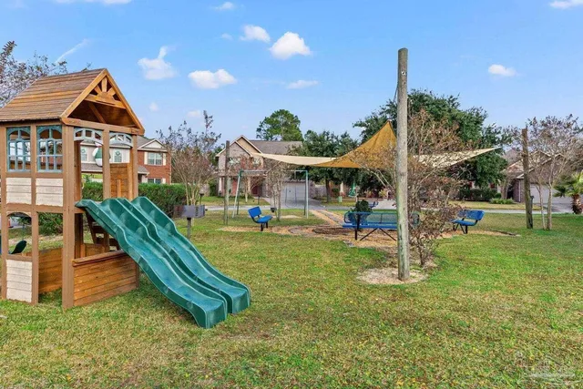 a childrens park with lots of swings and slides