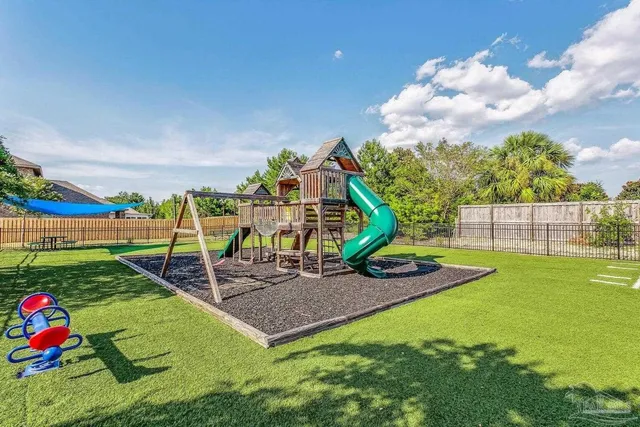 a view of a playground with basketball court