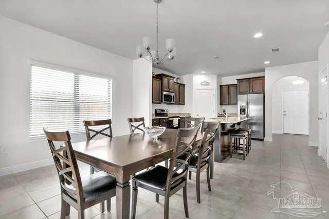 a view of a dining room with furniture