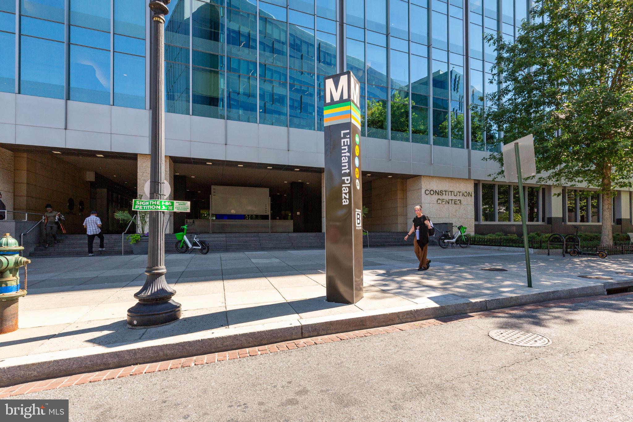 350 G Street Southwest, Unit N423 Washington, DC 20024 - Photo 43 of 43 Vibrant urban transit hub scene.