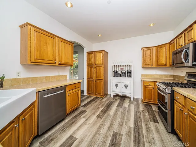 a living room with furniture and painting on the wall
