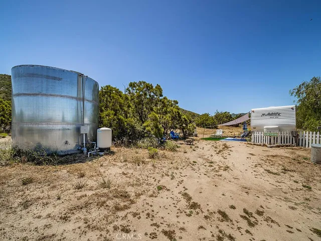 an aerial view of a house with outdoor space