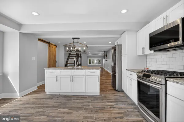 a kitchen with a stove and a microwave