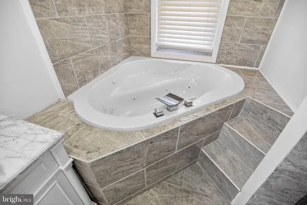 a bath tub sitting in a bathroom and