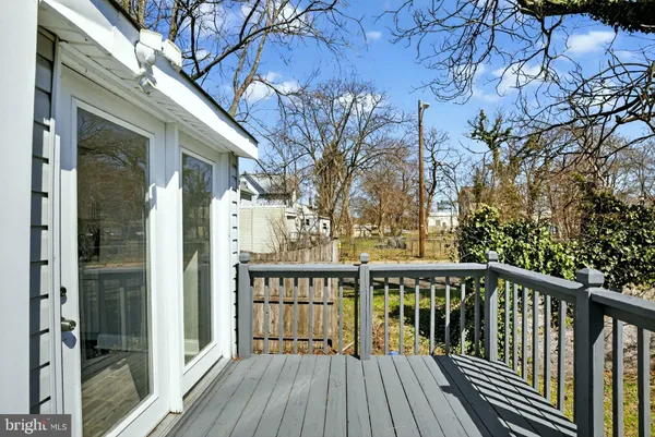 a view of a wooden deck with a yard