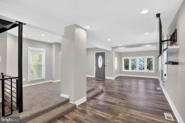 a view of an empty room and glass door