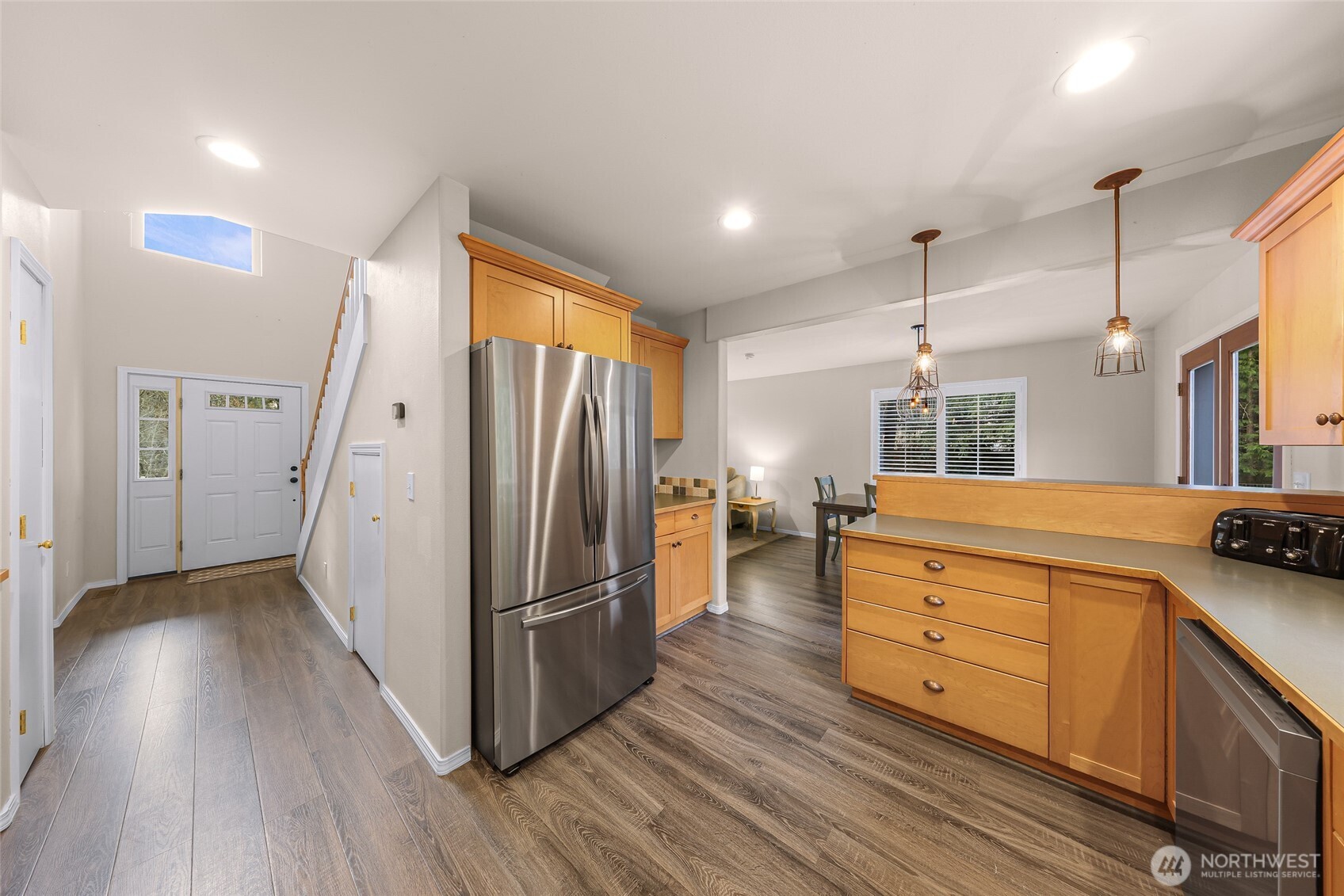 2976 Upland Way Ferndale, WA 98248 - Photo 18 of 38 a kitchen with stainless steel appliances kitchen island granite countertop a refrigerator and a stove