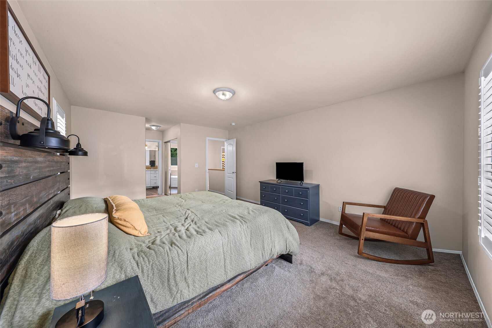 2976 Upland Way Ferndale, WA 98248 - Photo 22 of 38 a bedroom with a bed and a chair