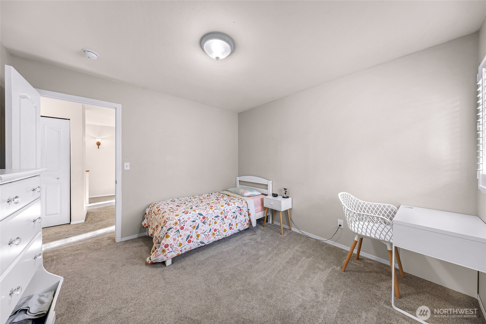 2976 Upland Way Ferndale, WA 98248 - Photo 27 of 38 a bedroom with a bed and chair