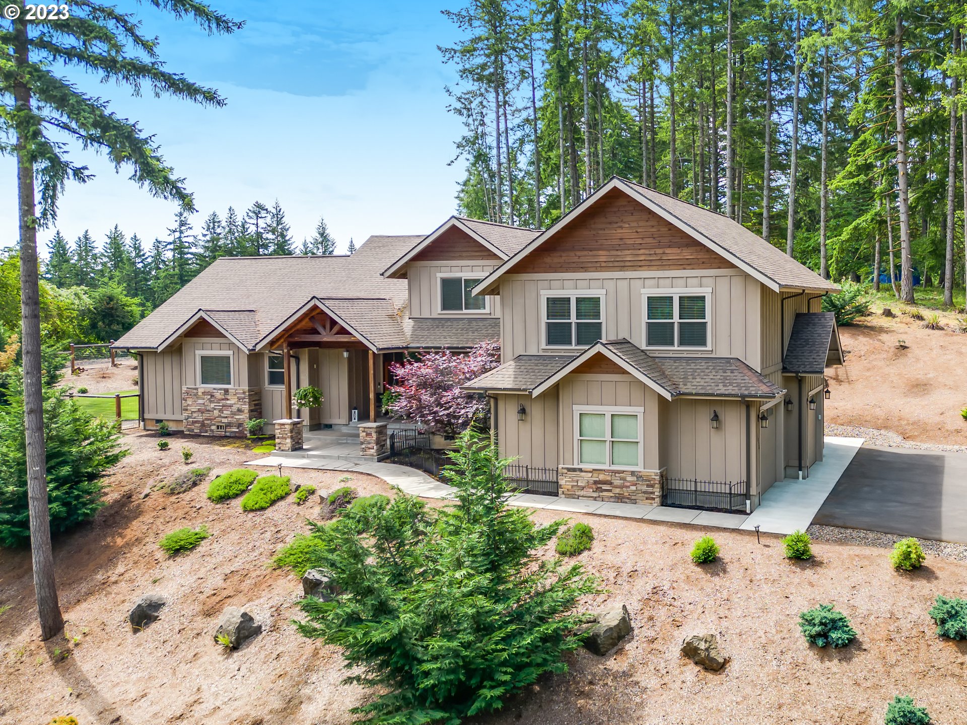 a front view of a house with garden