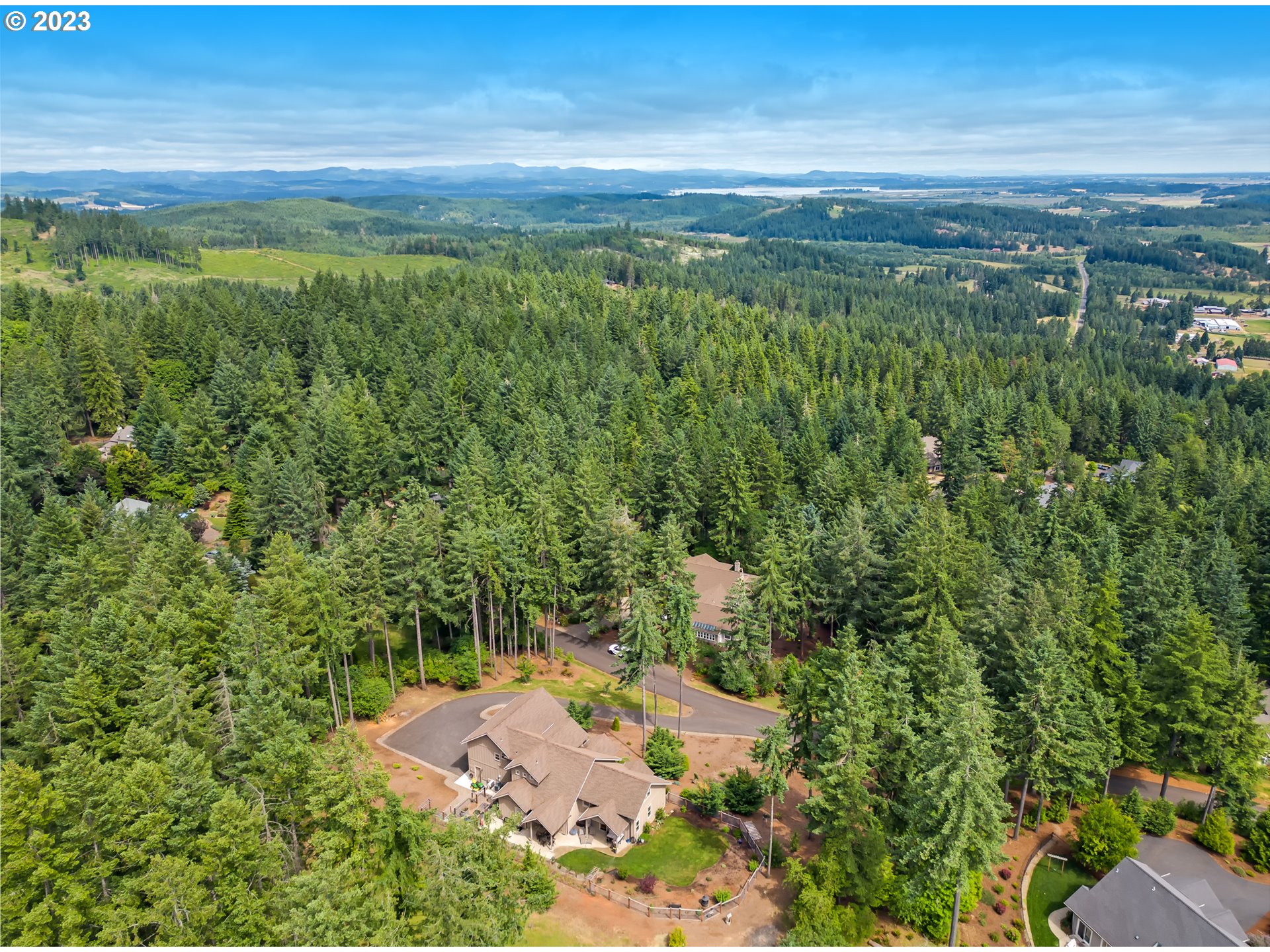 27876 Lady Slipper Loop Eugene, OR 97405 - Photo 12 of 45 a view of a city with lush green forest
