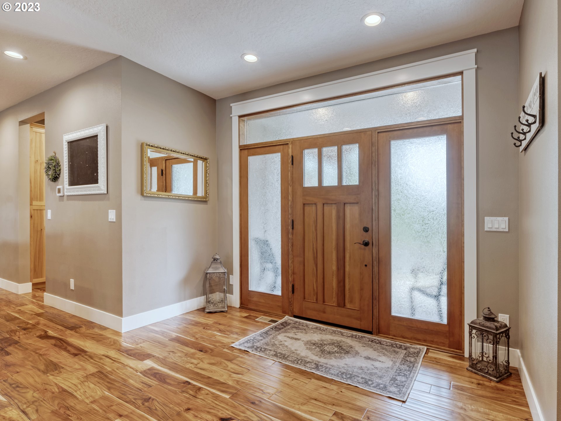 27876 Lady Slipper Loop Eugene, OR 97405 - Photo 15 of 45 an empty room with wooden floor and windows