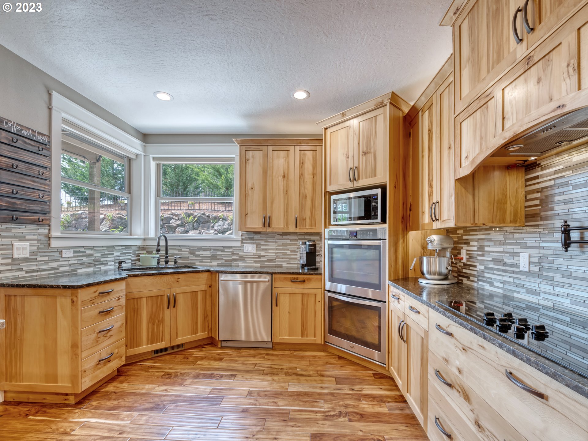 27876 Lady Slipper Loop Eugene, OR 97405 - Photo 18 of 45 a kitchen with stainless steel appliances granite countertop a stove and a sink