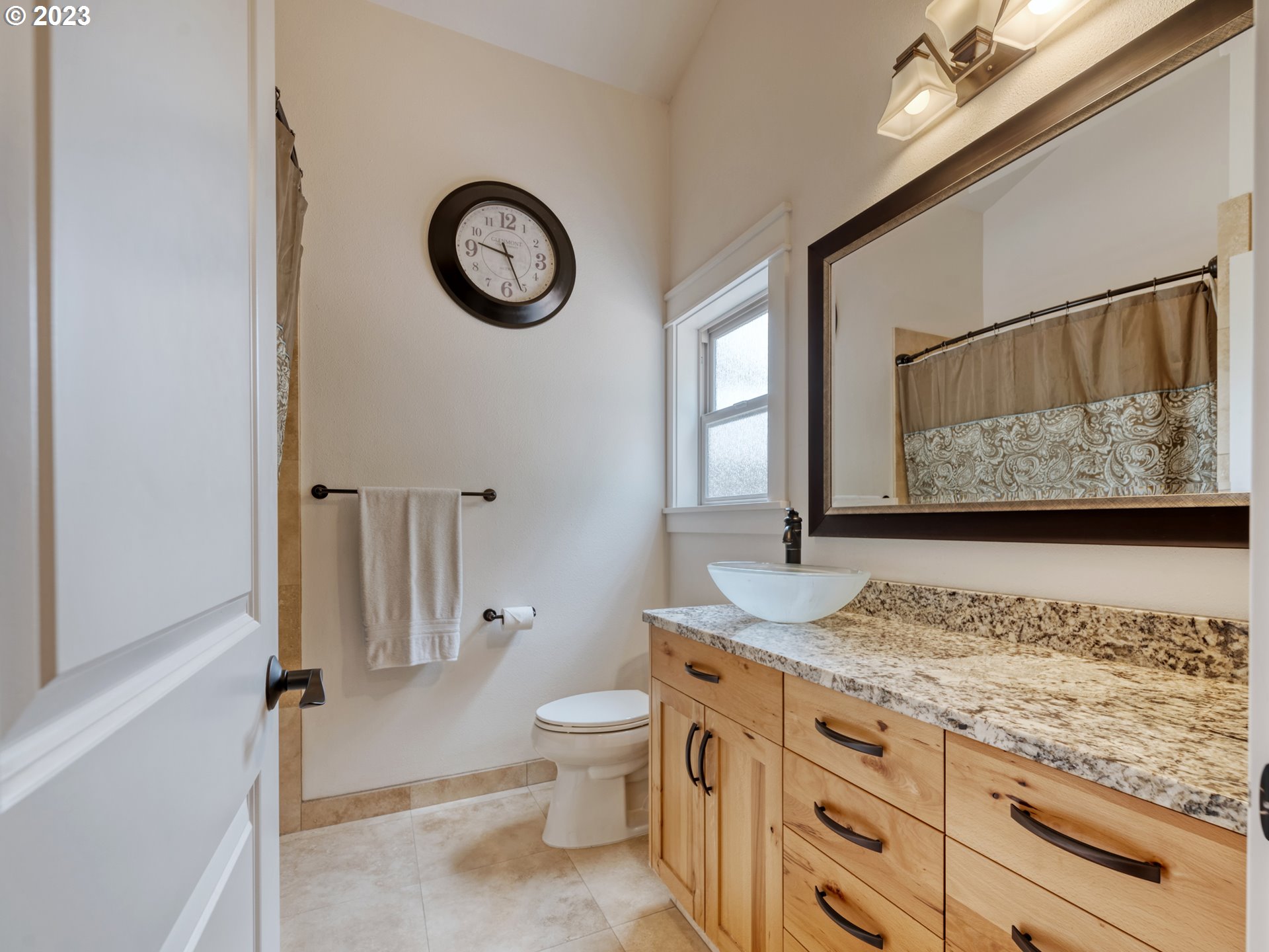 27876 Lady Slipper Loop Eugene, OR 97405 - Photo 19 of 45 a bathroom with a granite countertop sink and a mirror