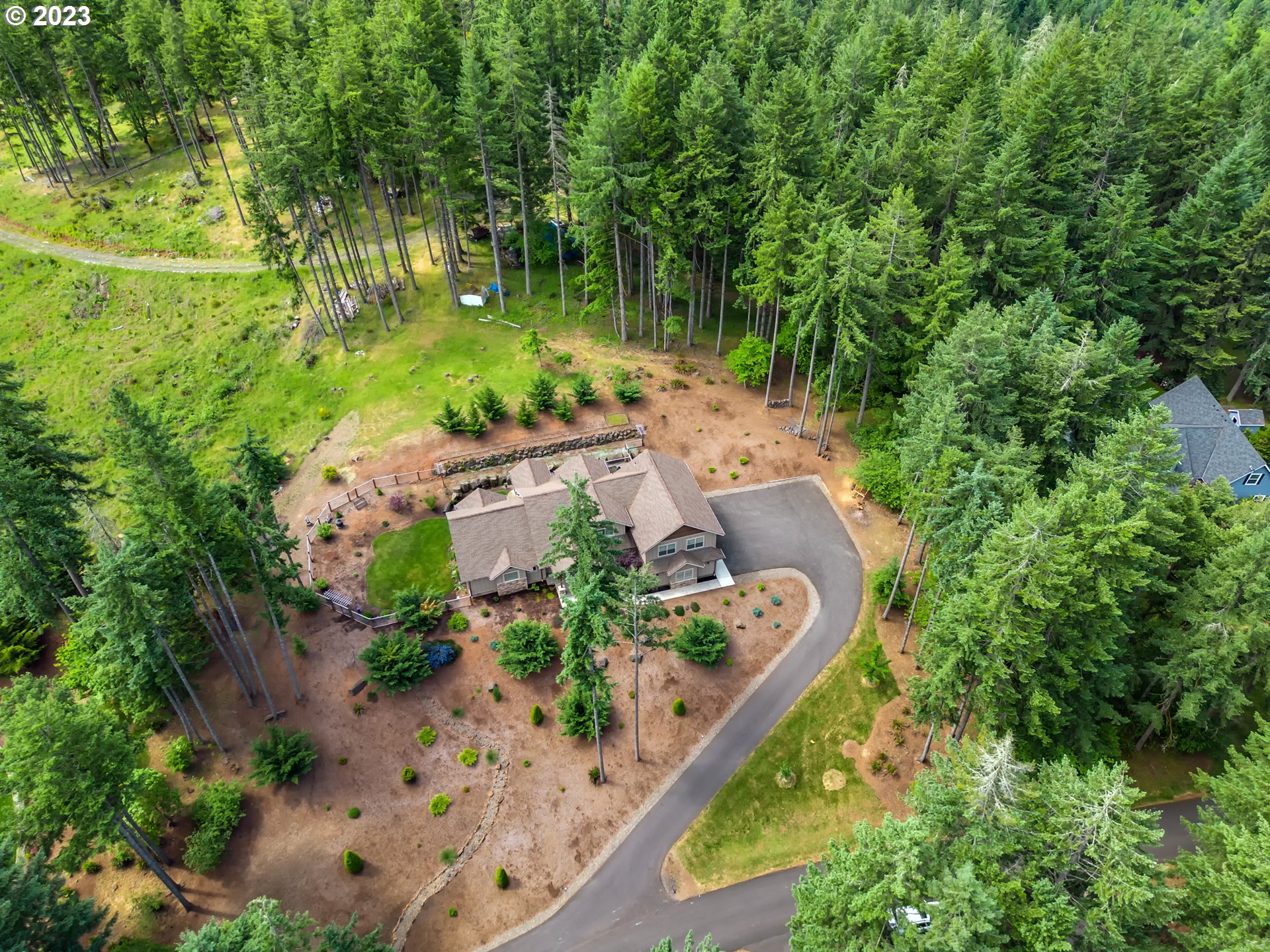 27876 Lady Slipper Loop Eugene, OR 97405 - Photo 2 of 45 a view of a garden with plants