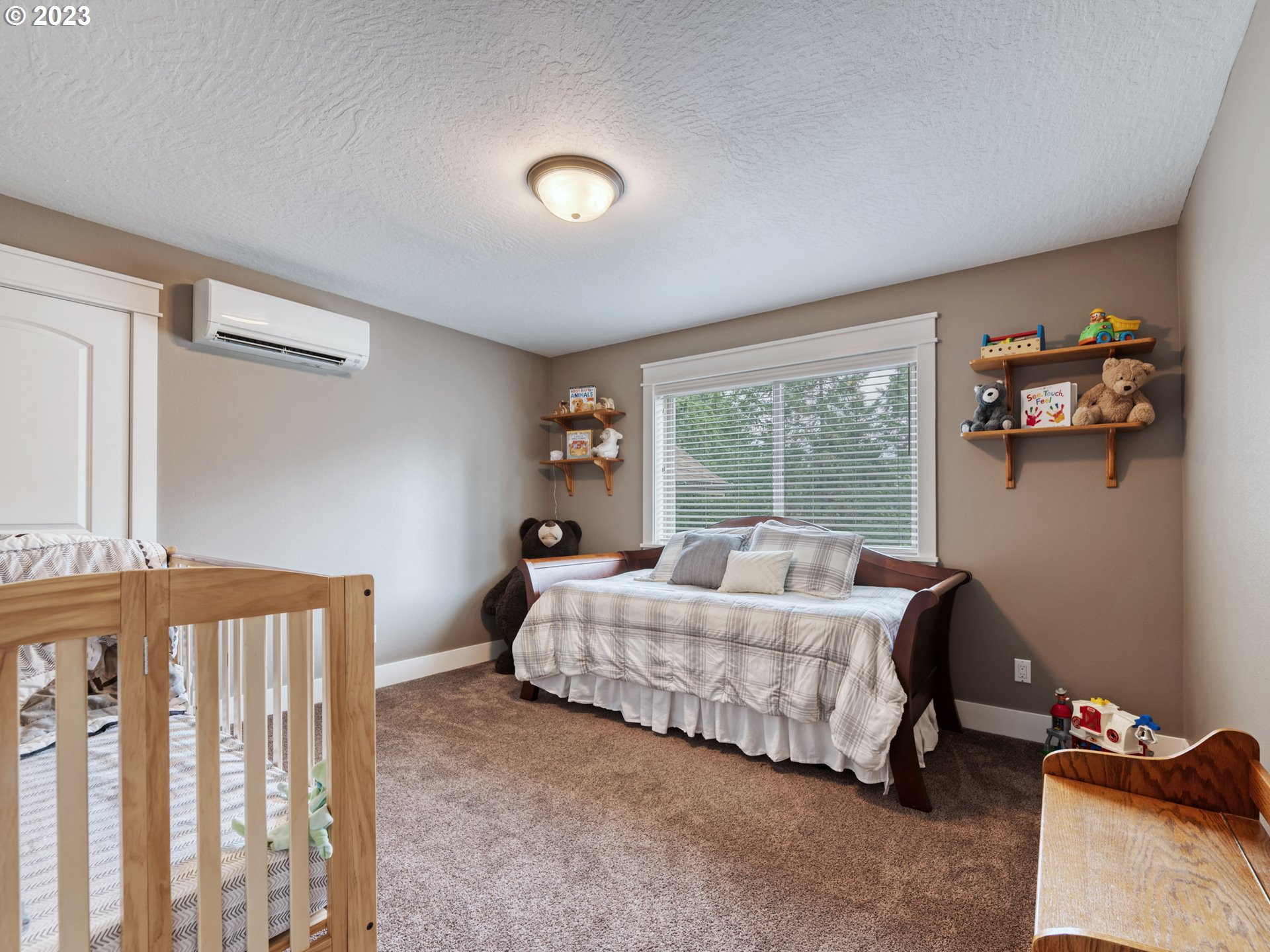 27876 Lady Slipper Loop Eugene, OR 97405 - Photo 26 of 45 a living room with a bed furniture and a window