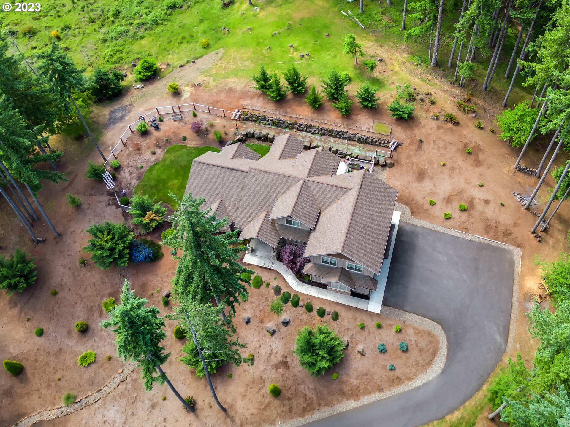 27876 Lady Slipper Loop Eugene, OR 97405 - Photo 3 of 45 an aerial view of a house with garden space and swimming pool