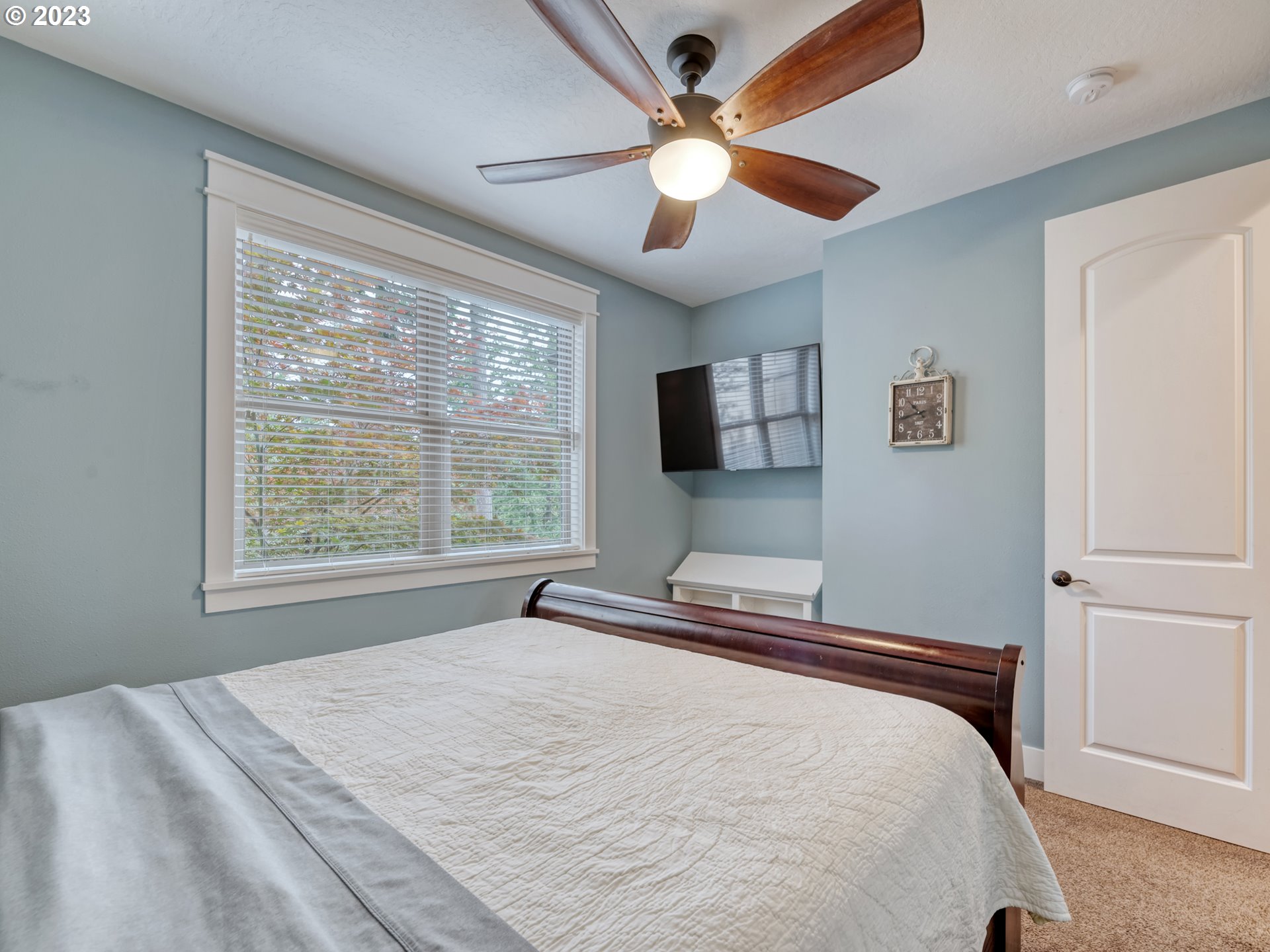 27876 Lady Slipper Loop Eugene, OR 97405 - Photo 32 of 45 a bedroom with a large bed and a flat screen tv