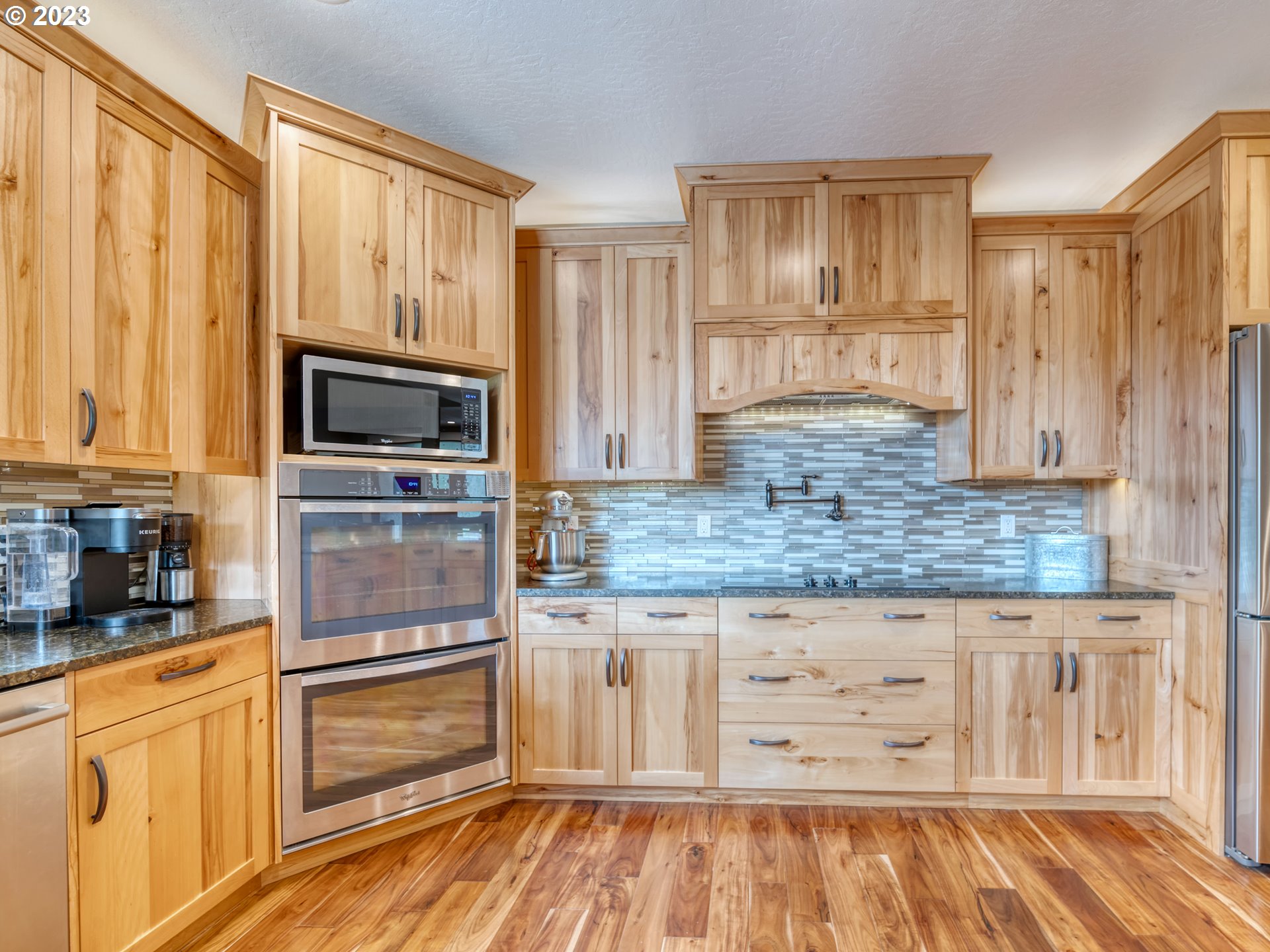 27876 Lady Slipper Loop Eugene, OR 97405 - Photo 39 of 45 a kitchen with granite countertop wooden cabinets and a granite counter tops