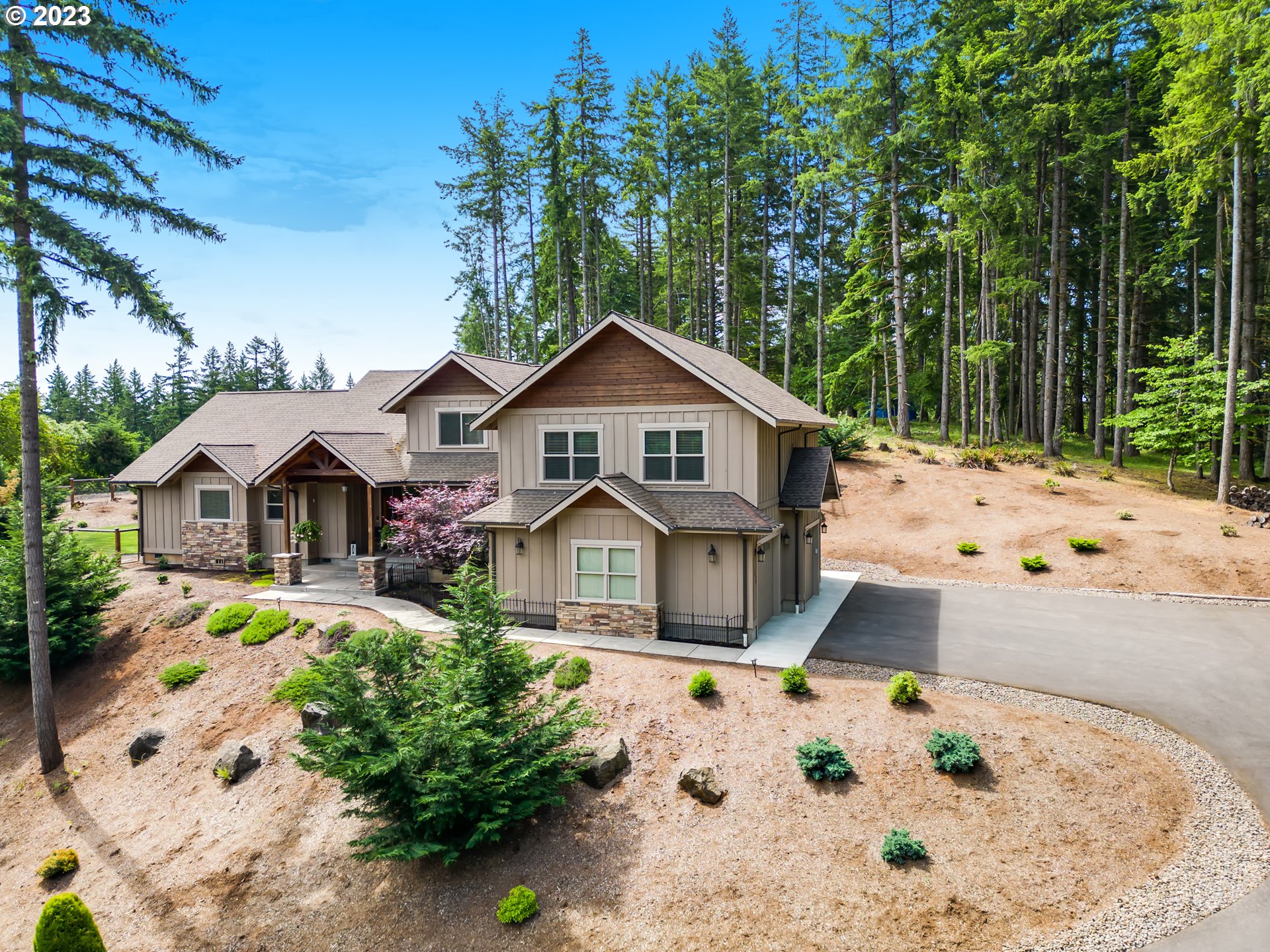 27876 Lady Slipper Loop Eugene, OR 97405 - Photo 5 of 45 a front view of a house with a yard and chandelier