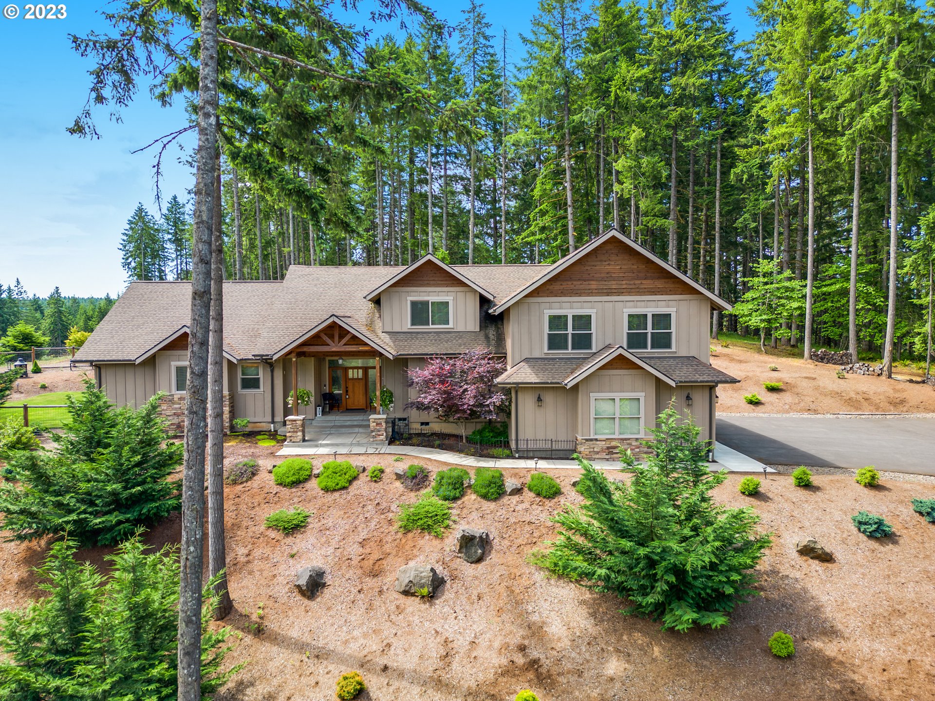 27876 Lady Slipper Loop Eugene, OR 97405 - Photo 8 of 45 a front view of a house with garden