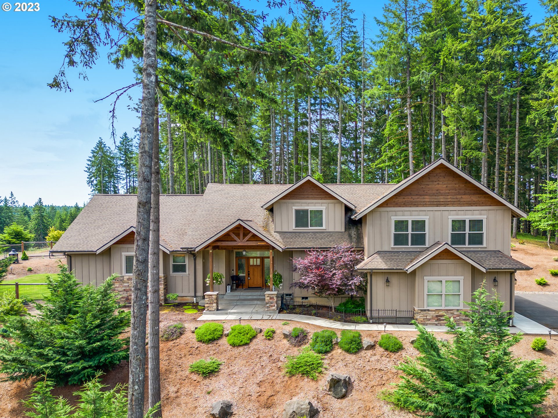 27876 Lady Slipper Loop Eugene, OR 97405 - Photo 9 of 45 a front view of house with yard and trees in the background