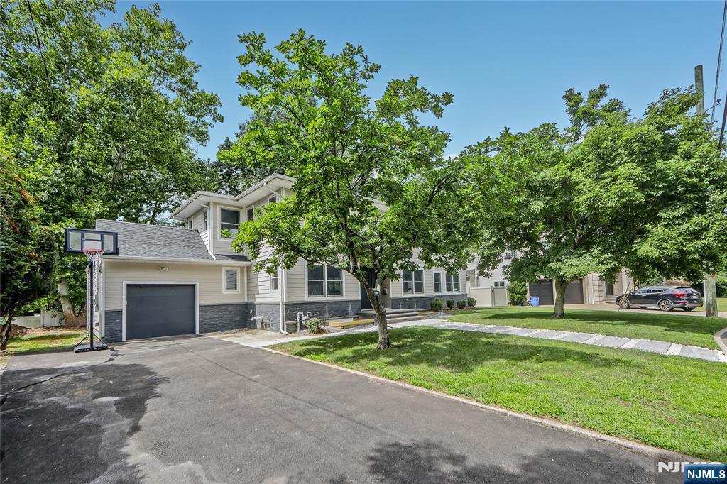 3 Laurel Road Demarest, NJ 07627 - Photo 11 of 43 a front view of a house with a yard