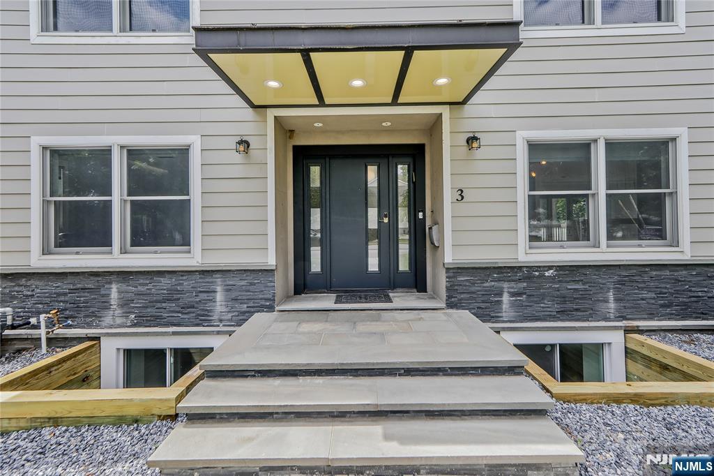 3 Laurel Road Demarest, NJ 07627 - Photo 13 of 43 a front view of a house with a yard