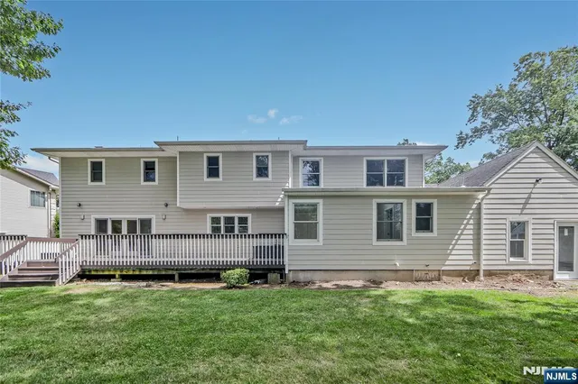 a view of backyard with deck