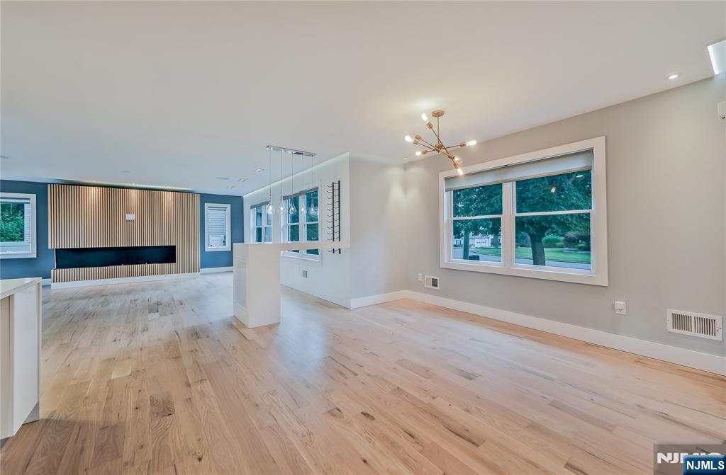 3 Laurel Road Demarest, NJ 07627 - Photo 21 of 43 a view of a livingroom with wooden floor fireplace and window