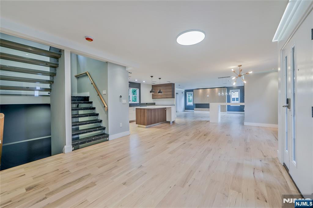 3 Laurel Road Demarest, NJ 07627 - Photo 22 of 43 a view of a kitchen with wooden floor and stairs