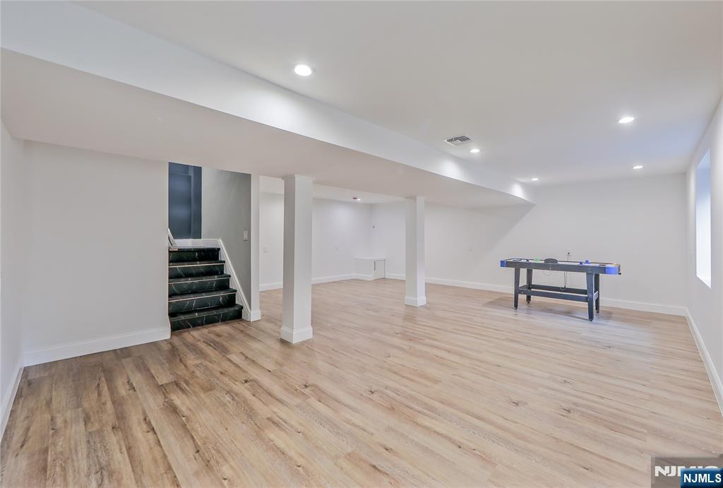 3 Laurel Road Demarest, NJ 07627 - Photo 30 of 43 a view of an empty room with wooden floor and stairs