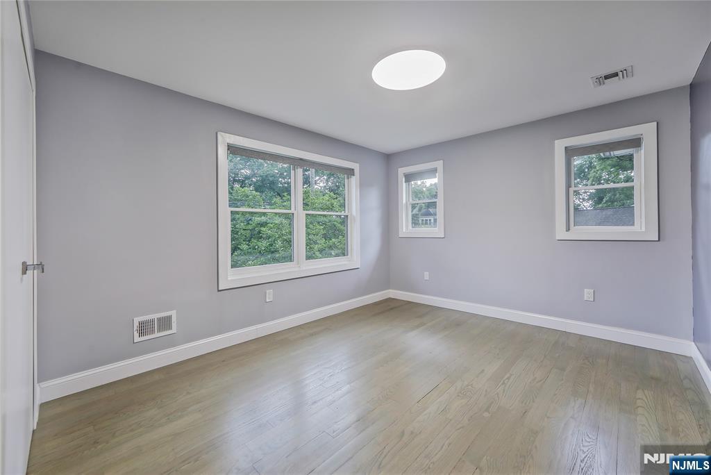3 Laurel Road Demarest, NJ 07627 - Photo 32 of 43 a view of an empty room with wooden floor and a window