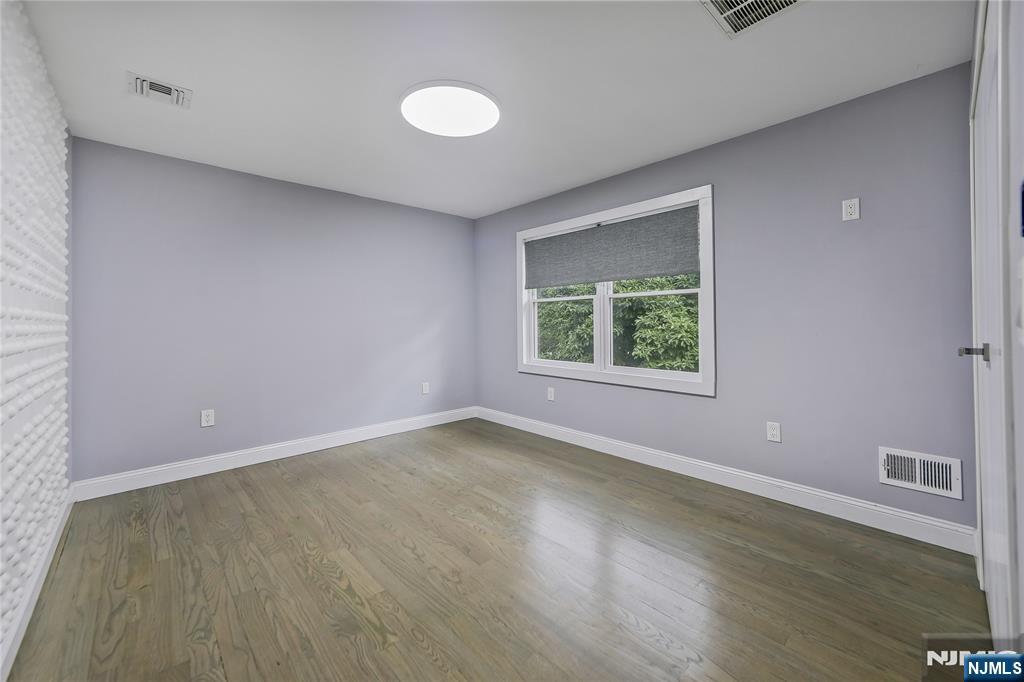 3 Laurel Road Demarest, NJ 07627 - Photo 33 of 43 a view of an empty room with wooden floor and a window