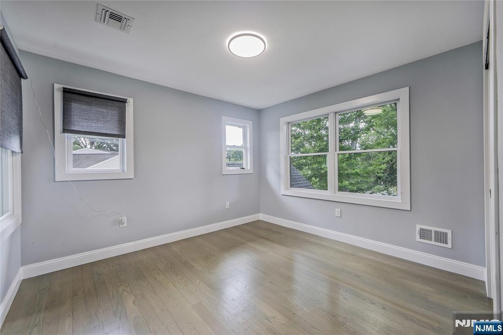 3 Laurel Road Demarest, NJ 07627 - Photo 35 of 43 a view of an empty room with wooden floor and a window