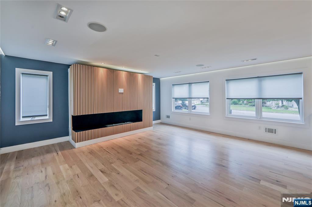 3 Laurel Road Demarest, NJ 07627 - Photo 42 of 43 a view of an empty room with a window and wooden floor