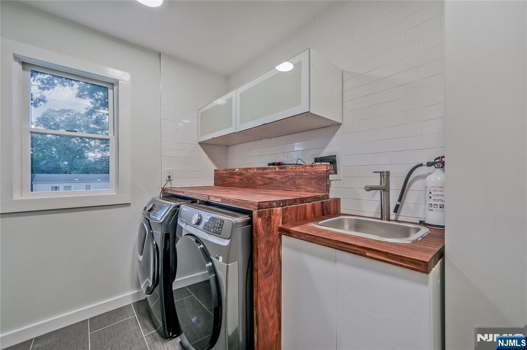 3 Laurel Road Demarest, NJ 07627 - Photo 43 of 43 a utility room with dryer and washer