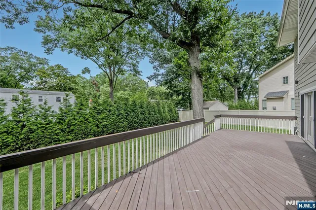a view of a balcony with wooden floor