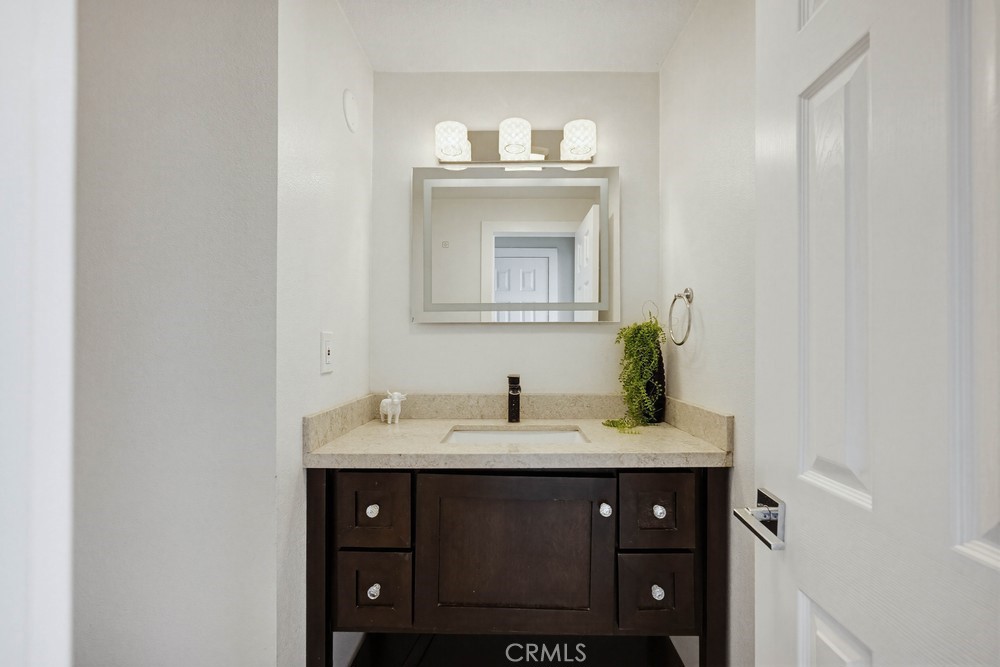 2256 Kentwood Drive Riverside, CA 92507 - Photo 11 of 26 a bathroom with a sink and a mirror
