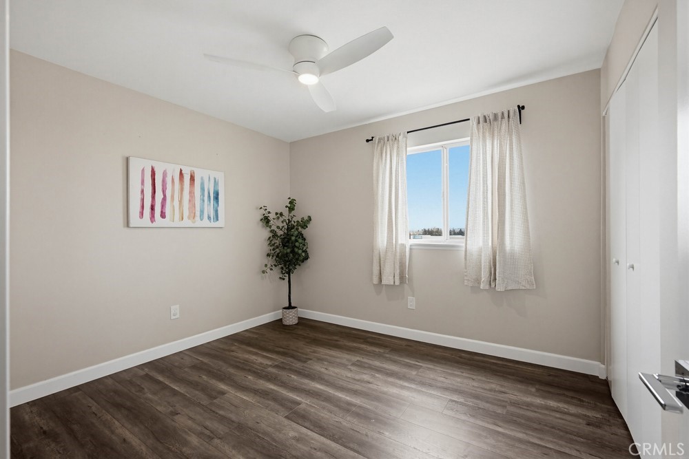 2256 Kentwood Drive Riverside, CA 92507 - Photo 16 of 26 an empty room with wooden floor and window