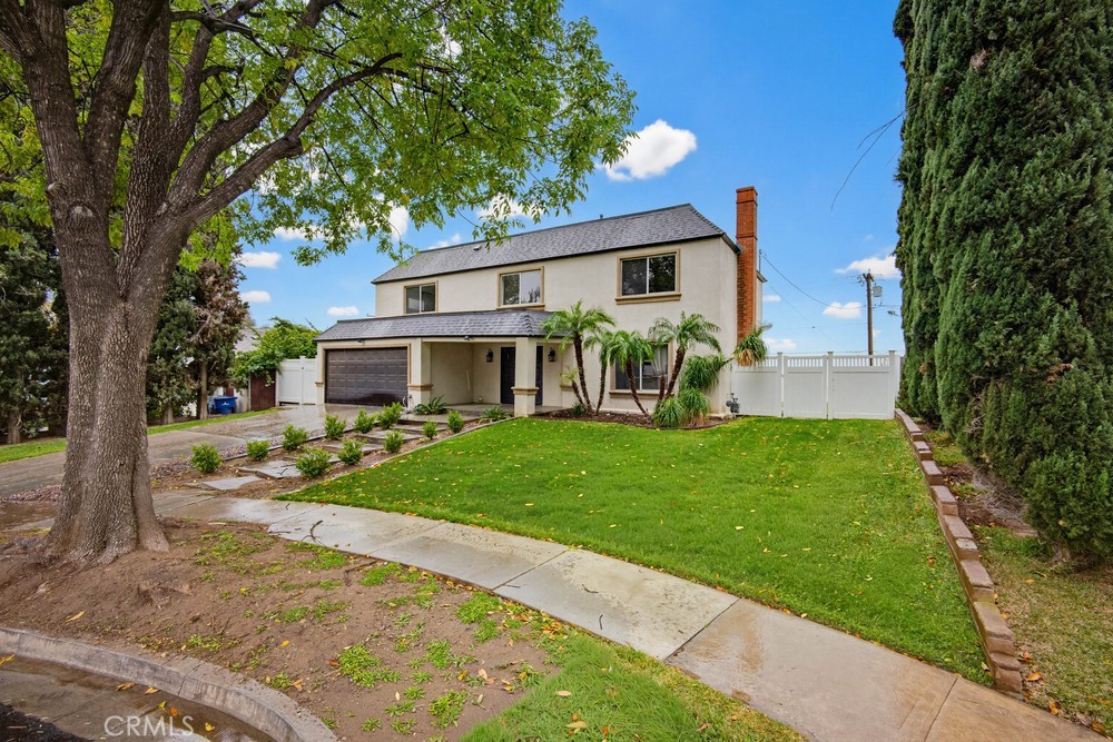 2256 Kentwood Drive Riverside, CA 92507 - Photo 3 of 26 a front view of a house with garden