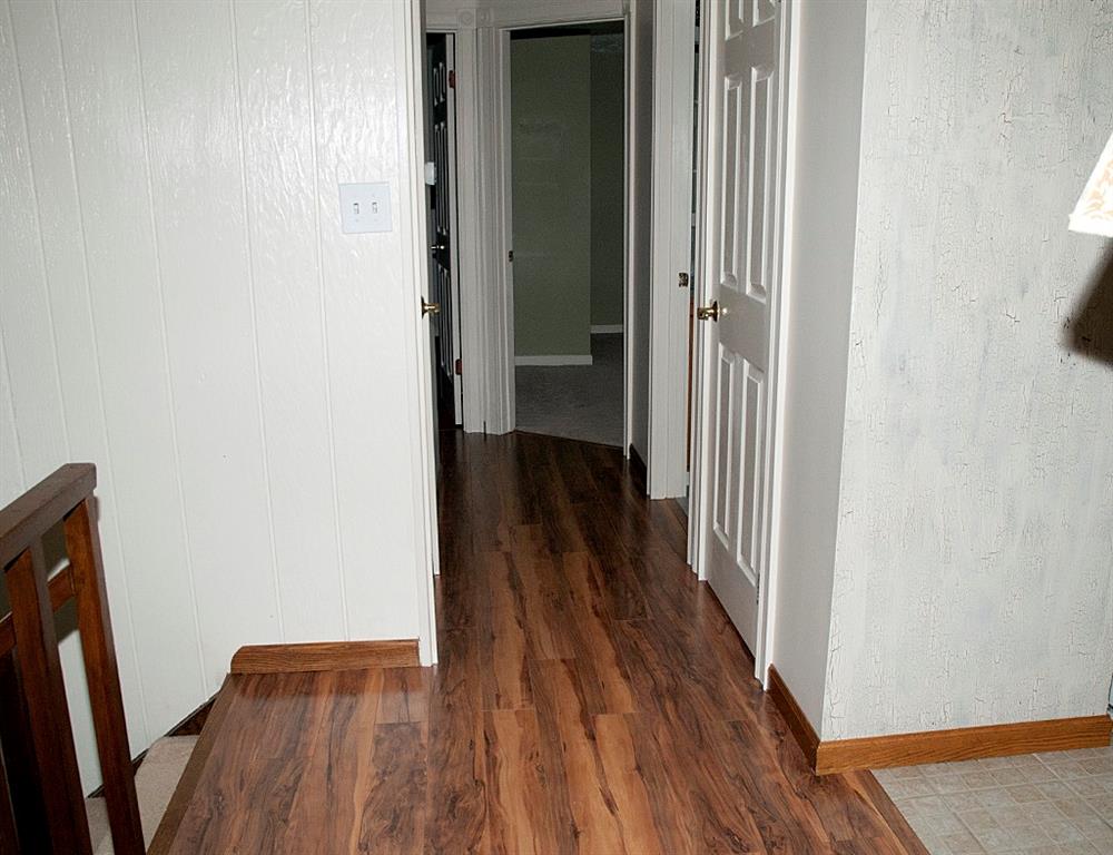 363 Brewer Road Rochester, PA 15074 - Photo 8 of 25 LAMINATE FLOORING CONTINUES INTO 3rd BEDROOM. 2 STORAGE CLOSETS IN HALLWAY