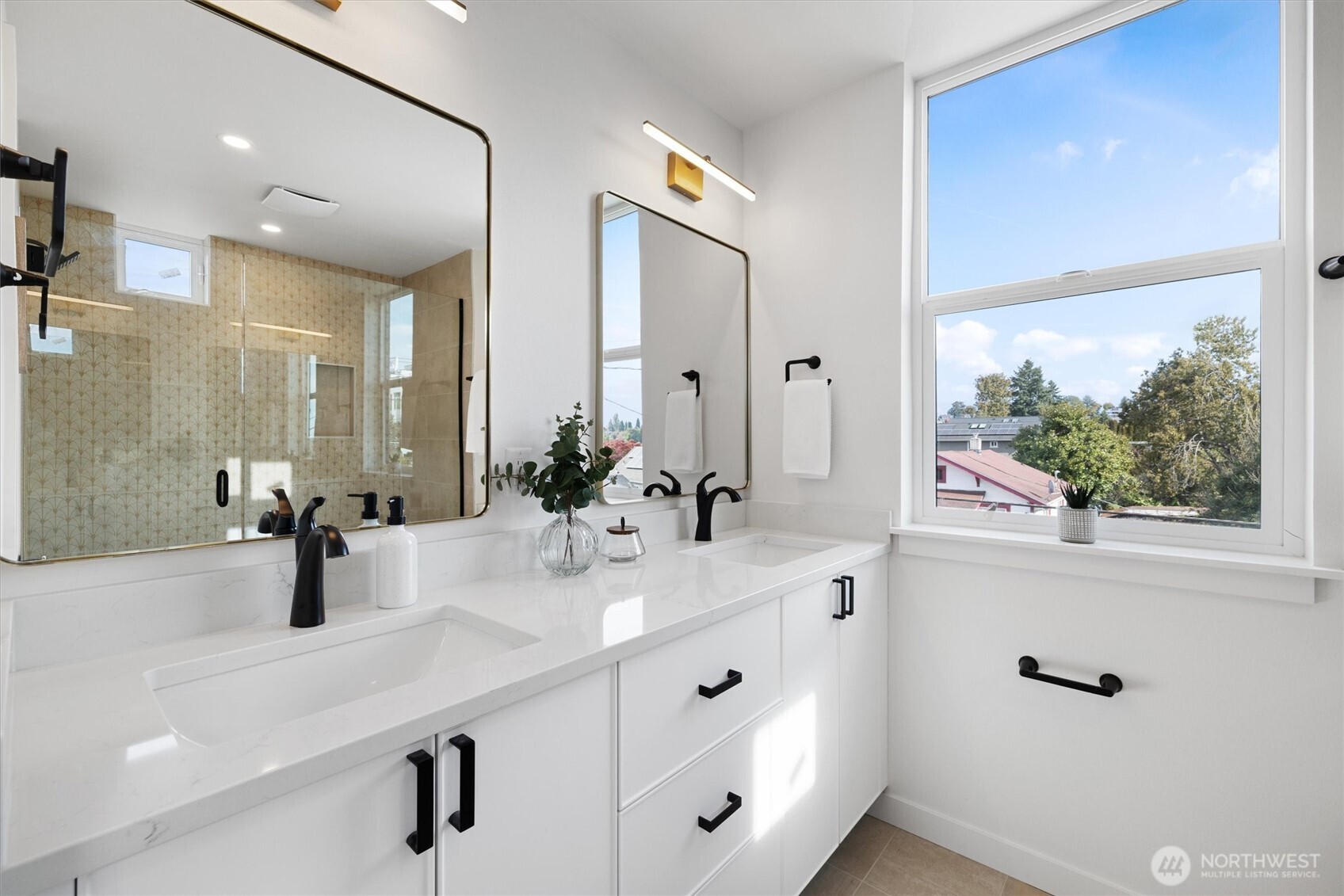 2317 South Judkins Street Seattle, WA 98144 - Photo 11 of 22 a bathroom with double vanity sinks a large mirror and vanity
