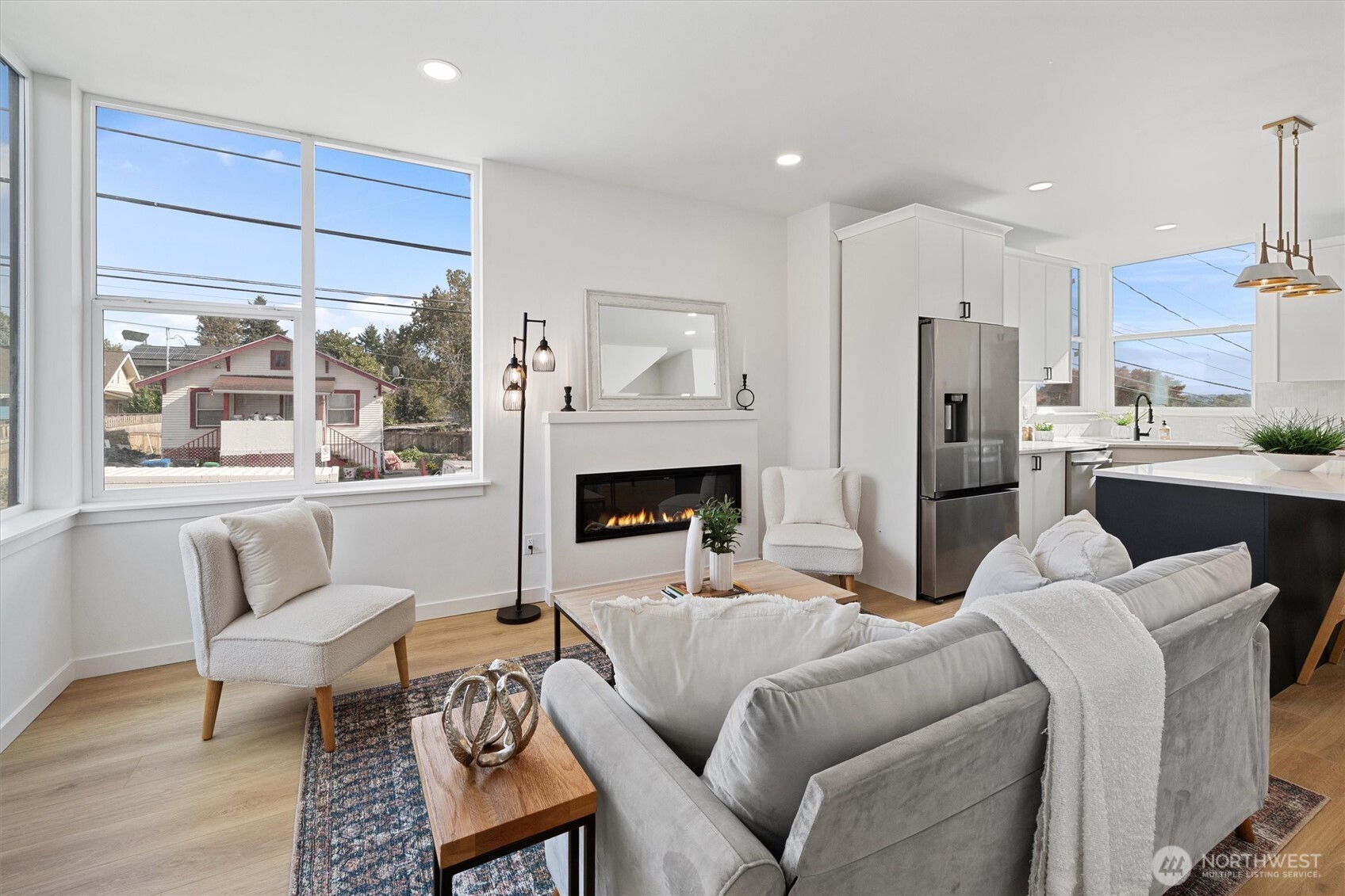 2317 South Judkins Street Seattle, WA 98144 - Photo 7 of 22 a living room with furniture a large window and a fireplace